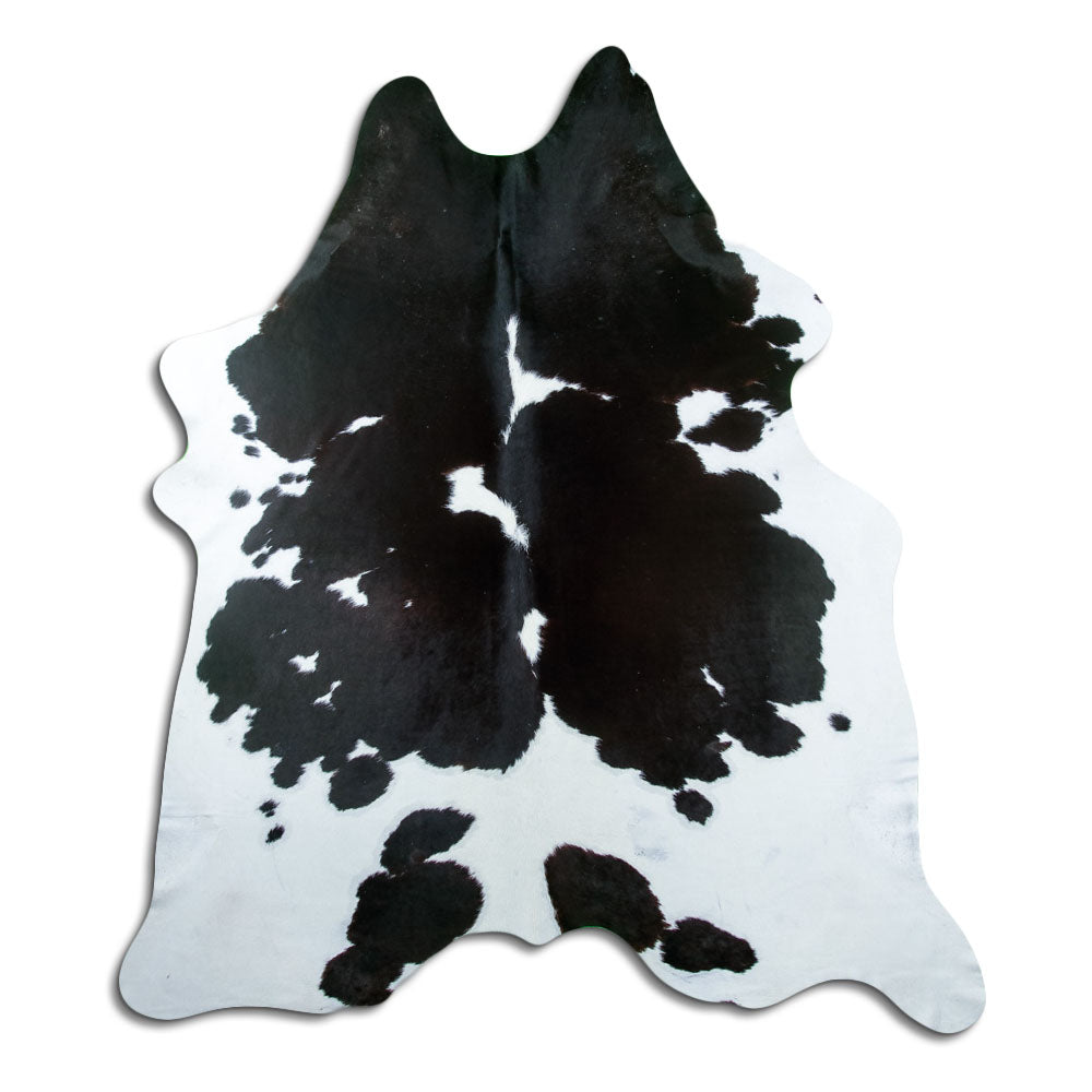 Peau de vache noir et blanc d’environ 230 × 200 cm, vue de dessus : exactement la peau que vous recevez