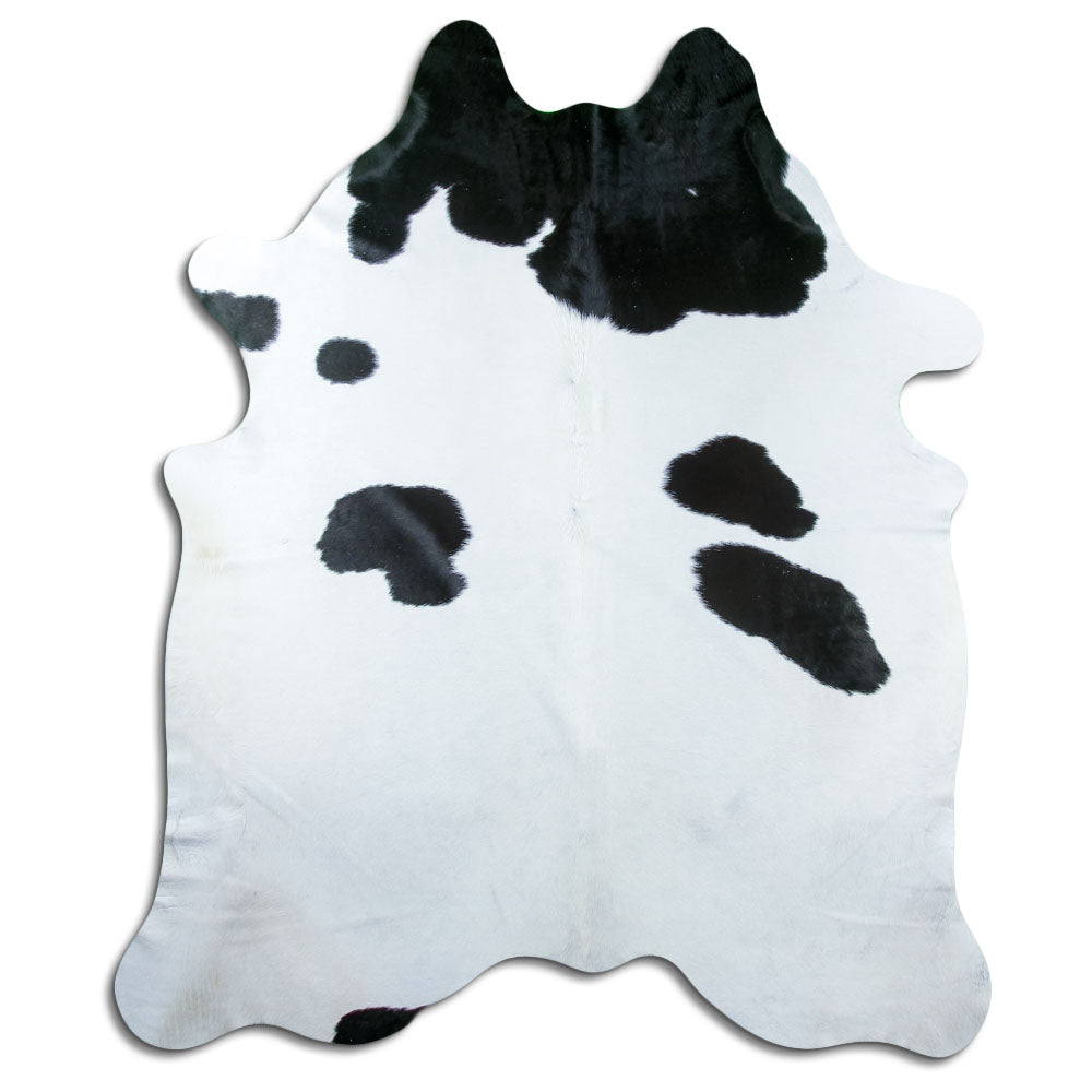 Peau de vache noir et blanc d’environ 220 × 190 cm, vue de dessus : exactement la peau que vous recevez