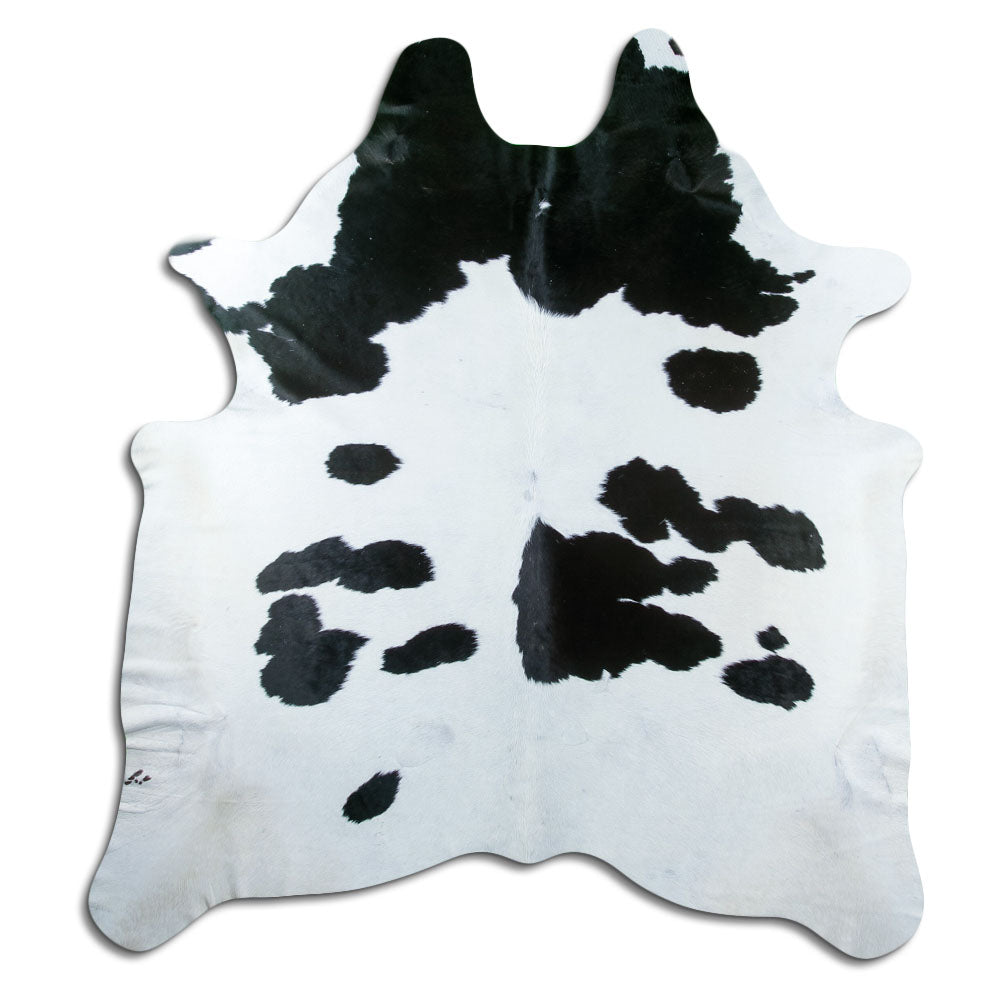 Peau de vache noir et blanc d’environ 220 × 200 cm, vue de dessus : exactement la peau que vous recevez