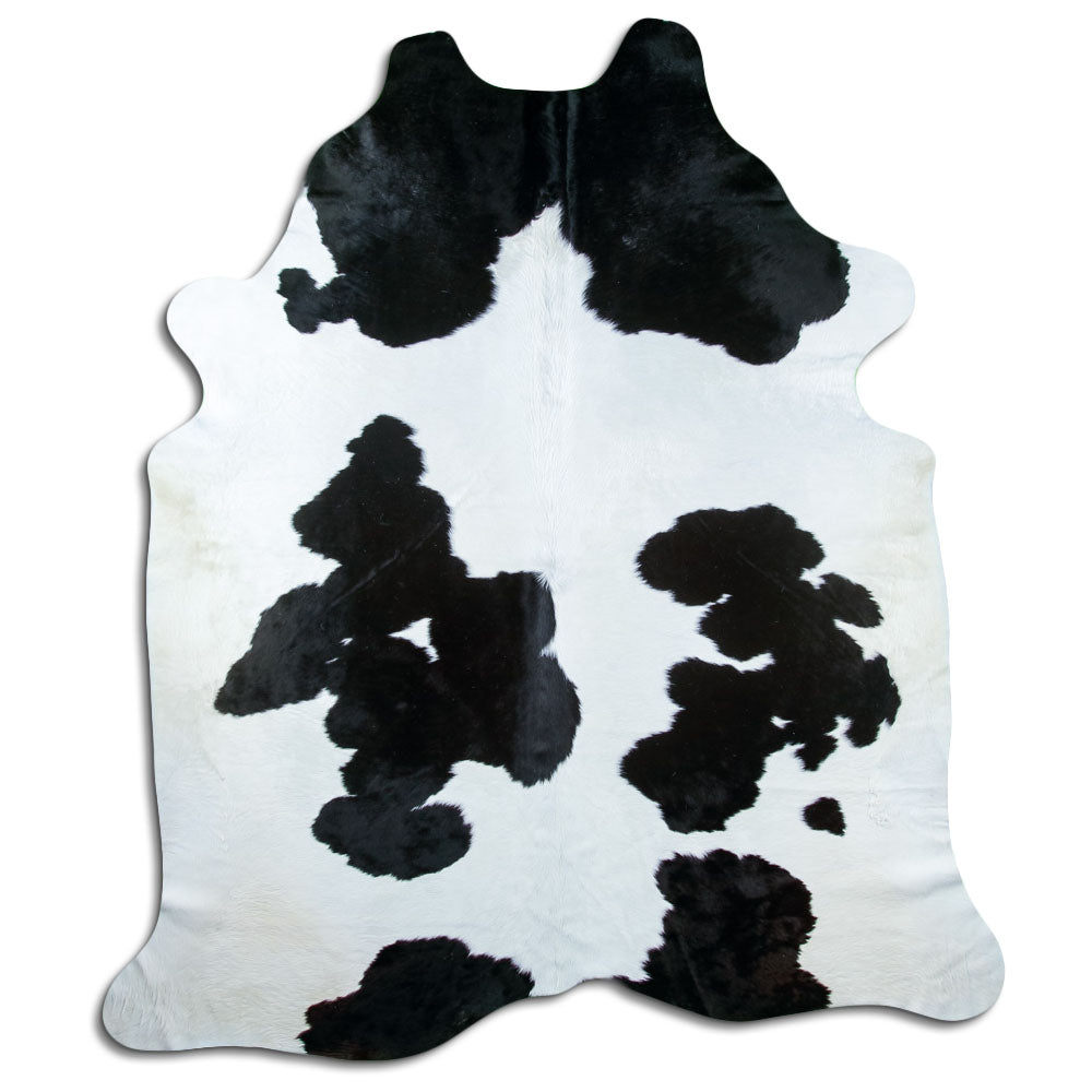 Peau de vache noir et blanc d’environ 250 × 220 cm, vue de dessus : exactement la peau que vous recevez