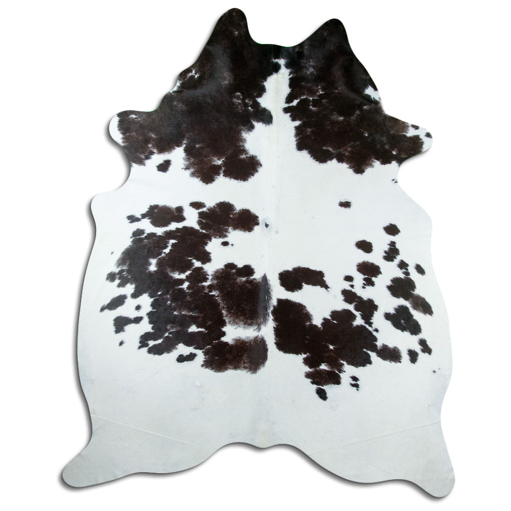 Peau de vache noir et blanc d’environ 240 × 200 cm, vue de dessus : exactement la peau que vous recevez