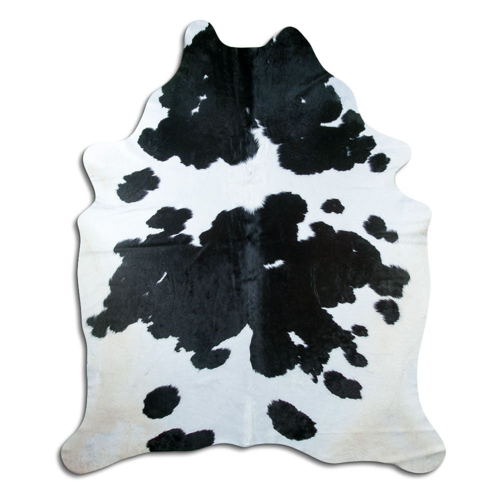 Peau de vache noir et blanc d’environ 230 × 200 cm, vue de dessus : exactement la peau que vous recevez
