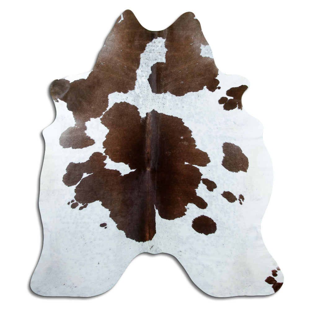 Peau de vache marron et blanc d’environ 200 × 170 cm, vue de dessus : exactement la peau que vous recevez