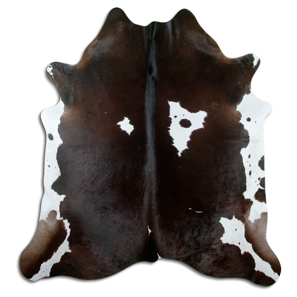 Peau de vache marron et blanc d’environ 200 × 190 cm, vue de dessus : exactement la peau que vous recevez