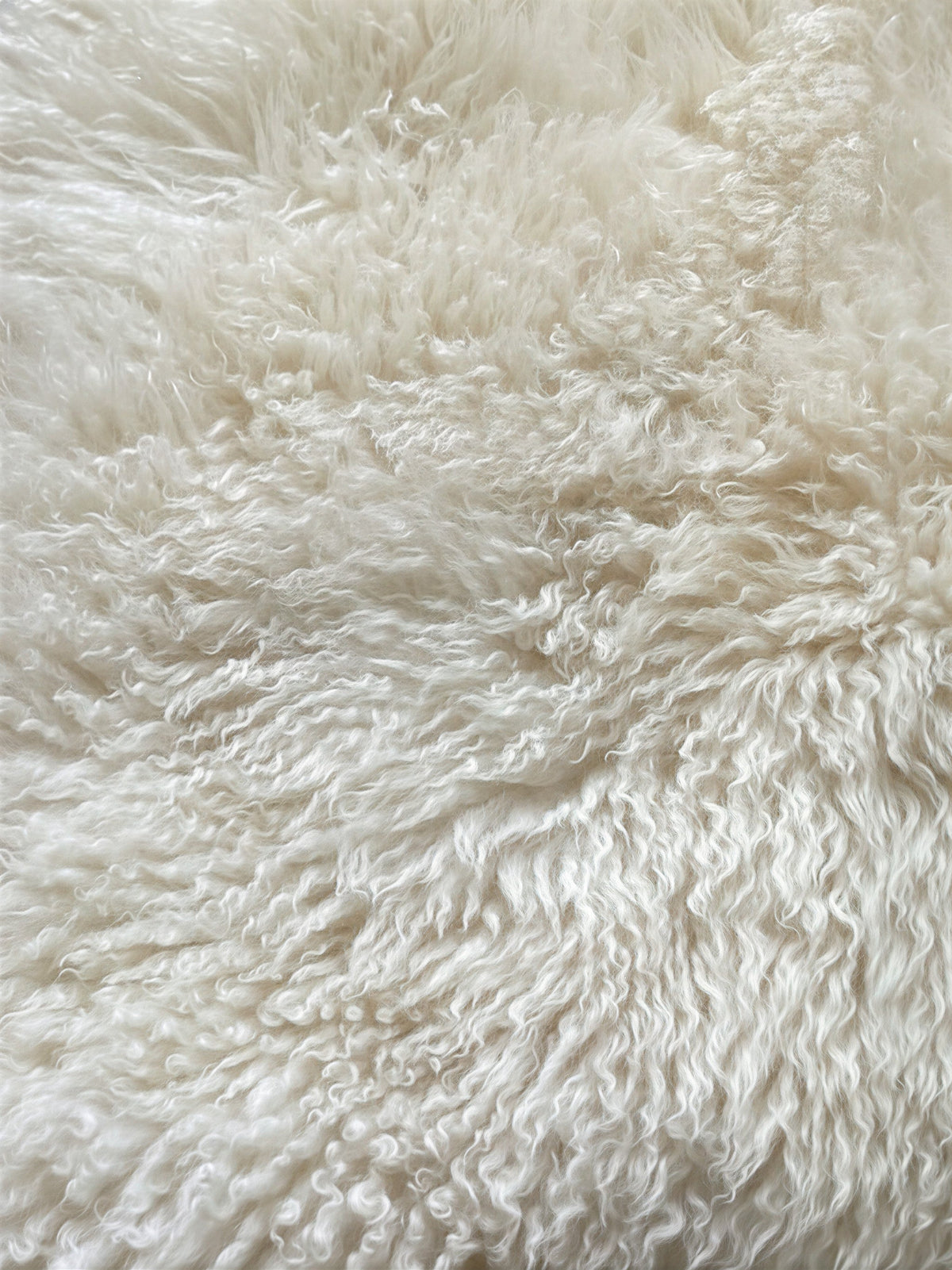 peau de mouton blanche bouclée