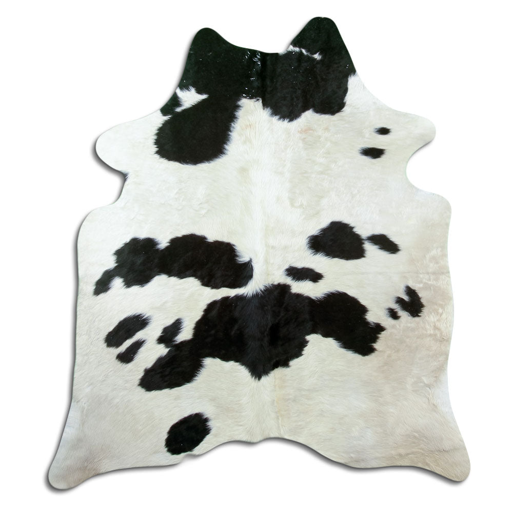Peau de vache noir et blanc d’environ 180 × 160 cm, vue de dessus : exactement la peau que vous recevez