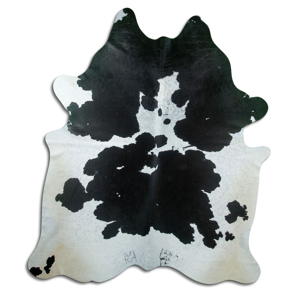 Peau de vache noir et blanc d’environ 230 × 190 cm, vue de dessus : exactement la peau que vous recevez