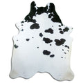 Peau de vache noir et blanc d’environ 230 × 190 cm, vue de dessus : exactement la peau que vous recevez