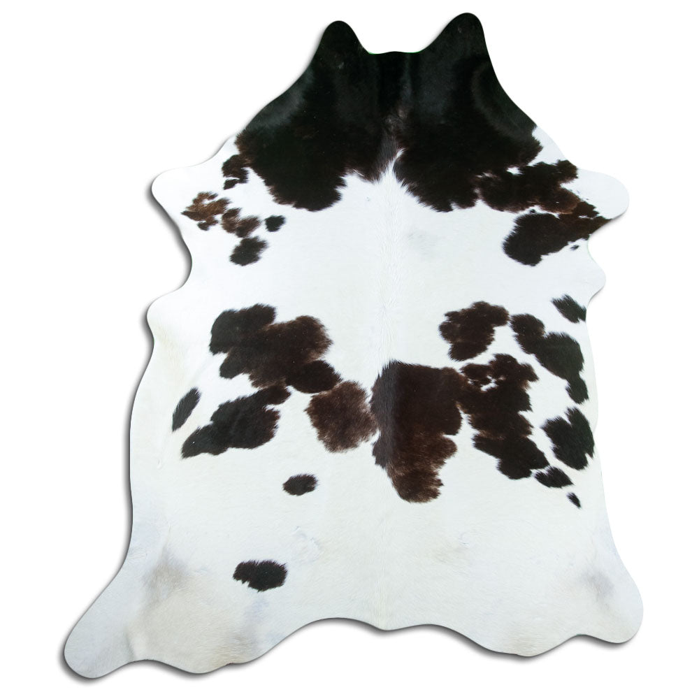 Peau de vache noir et blanc d’environ 230 × 190 cm, vue de dessus : exactement la peau que vous recevez