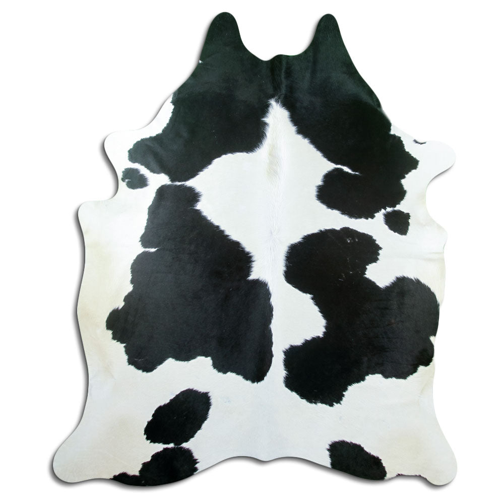 Peau de vache noir et blanc d’environ 220 × 190 cm, vue de dessus : exactement la peau que vous recevez