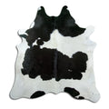 Peau de vache noir et blanc d’environ 200 × 200 cm, vue de dessus : exactement la peau que vous recevez