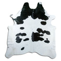 Peau de vache noir et blanc d’environ 220 × 200 cm, vue de dessus : exactement la peau que vous recevez