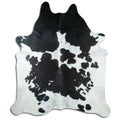 Peau de vache noir et blanc d’environ 240 × 210 cm, vue de dessus : exactement la peau que vous recevez