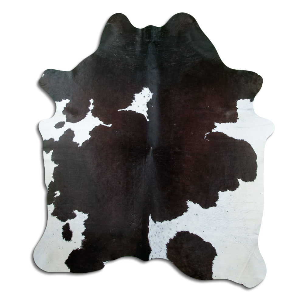 Peau de vache noir et blanc d’environ 200 × 180 cm, vue de dessus : exactement la peau que vous recevez