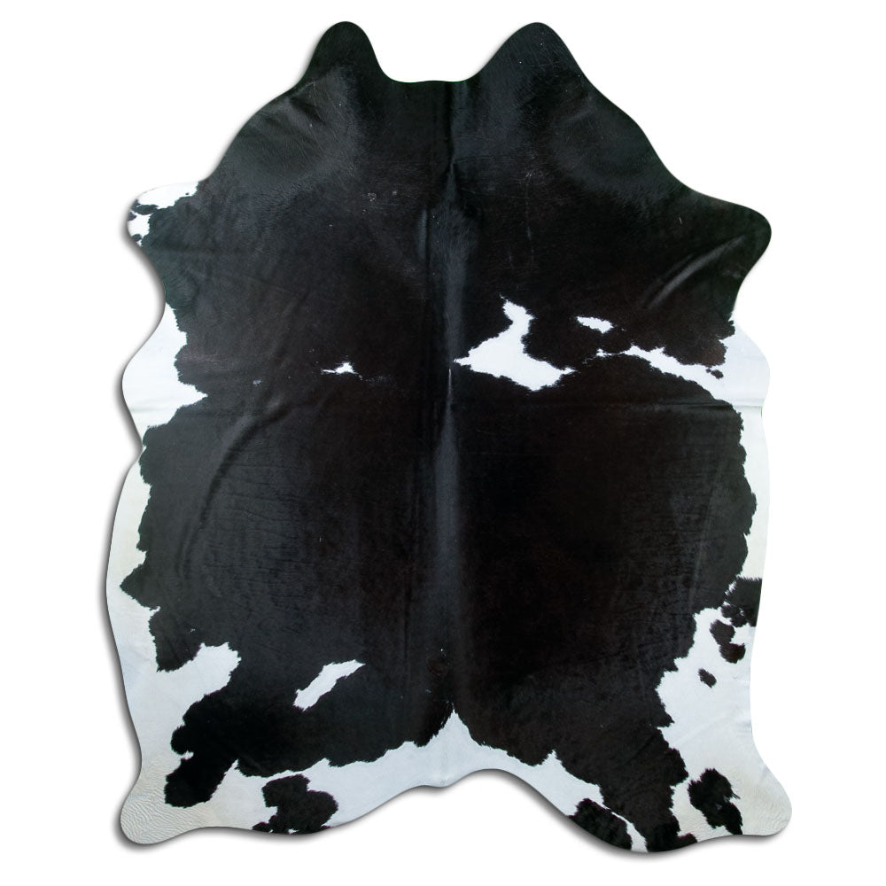 Peau de vache noir et blanc d’environ 230 × 180 cm, vue de dessus : exactement la peau que vous recevez