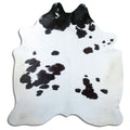 Peau de vache noir et blanc d’environ 220 × 210 cm, vue de dessus : exactement la peau que vous recevez