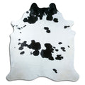 Peau de vache noir et blanc d’environ 220 × 210 cm, vue de dessus : exactement la peau que vous recevez