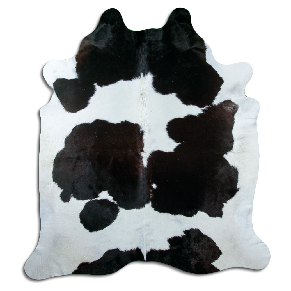 Peau de vache noir et blanc d’environ 220 × 190 cm, vue de dessus : exactement la peau que vous recevez