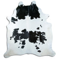 Peau de vache noir et blanc d’environ 240 × 210 cm, vue de dessus : exactement la peau que vous recevez