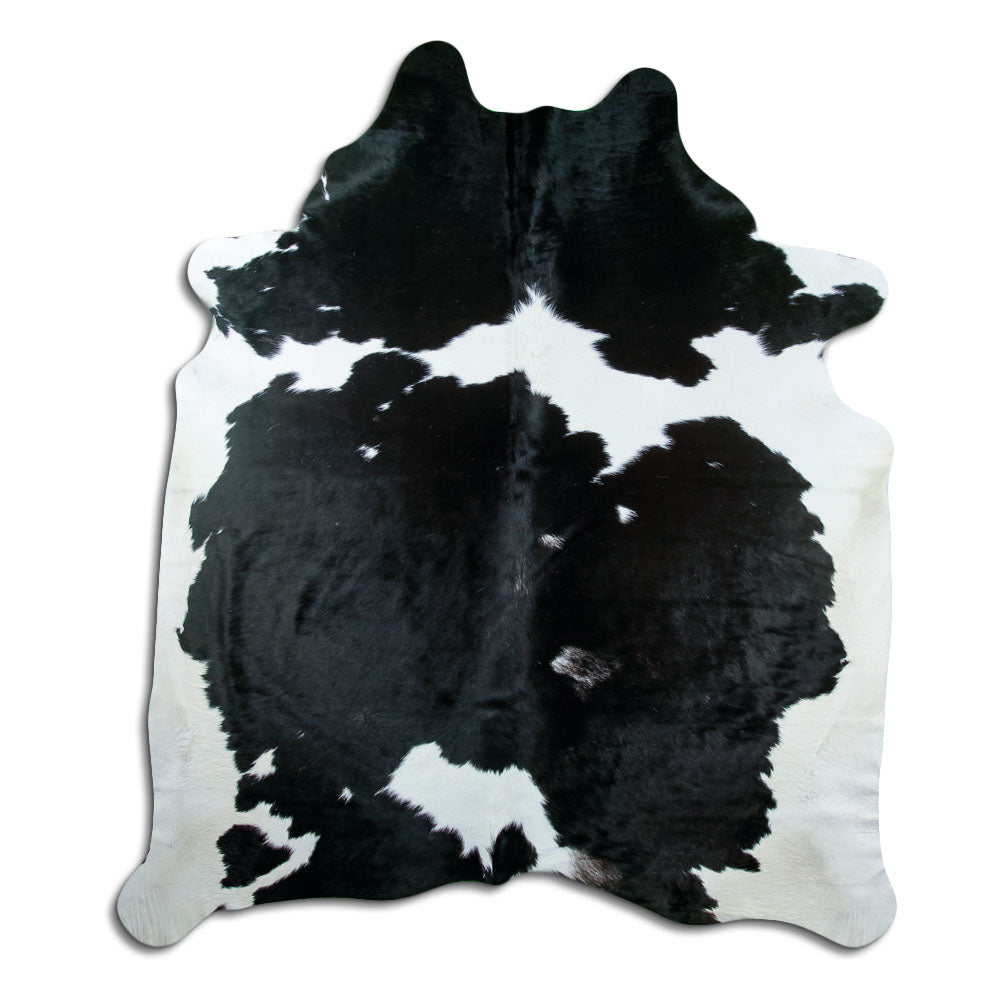 Peau de vache noir et blanc d’environ 230 × 200 cm, vue de dessus : exactement la peau que vous recevez