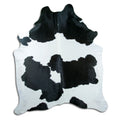 Peau de vache noir et blanc d’environ 230 × 190 cm, vue de dessus : exactement la peau que vous recevez