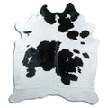 Peau de vache noir et blanc d’environ 210 × 190 cm, vue de dessus : exactement la peau que vous recevez