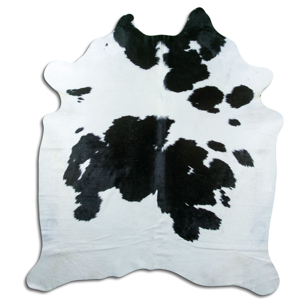 Peau de vache noir et blanc d’environ 210 × 190 cm, vue de dessus : exactement la peau que vous recevez
