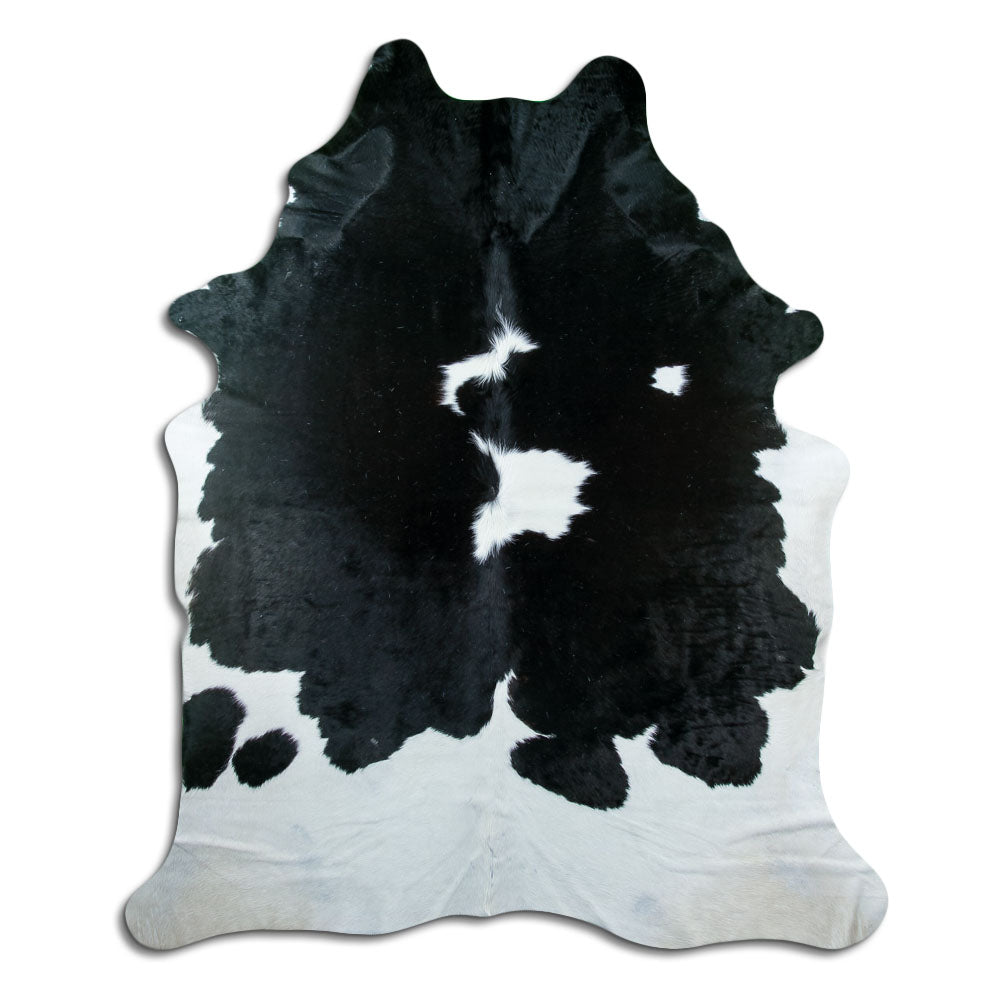 Peau de vache noir et blanc d’environ 230 × 190 cm, vue de dessus : exactement la peau que vous recevez
