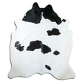 Peau de vache noir et blanc d’environ 210 × 190 cm, vue de dessus : exactement la peau que vous recevez