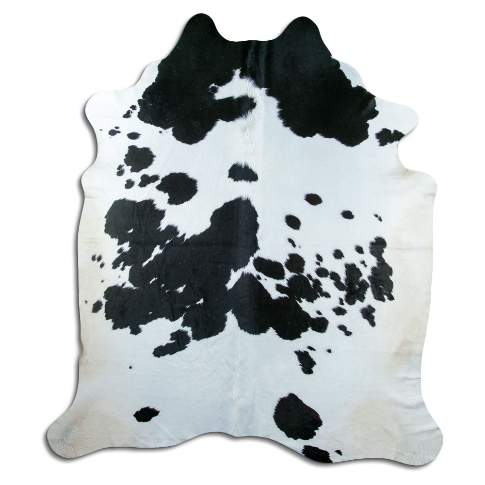 Peau de vache noir et blanc d’environ 230 × 200 cm, vue de dessus : exactement la peau que vous recevez