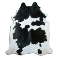 Peau de vache noir et blanc d’environ 220 × 190 cm, vue de dessus : exactement la peau que vous recevez