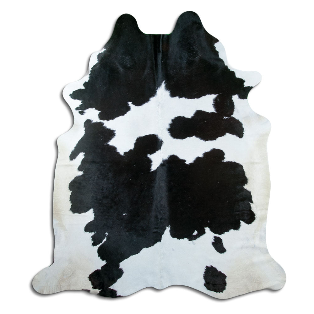 Peau de vache noir et blanc d’environ 220 × 190 cm, vue de dessus : exactement la peau que vous recevez