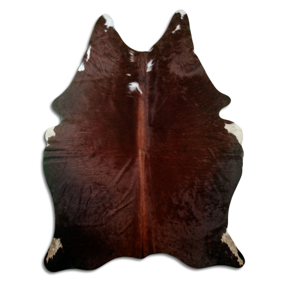 Peau de vache marron et blanc d’environ 200 × 160 cm, vue de dessus : exactement la peau que vous recevez