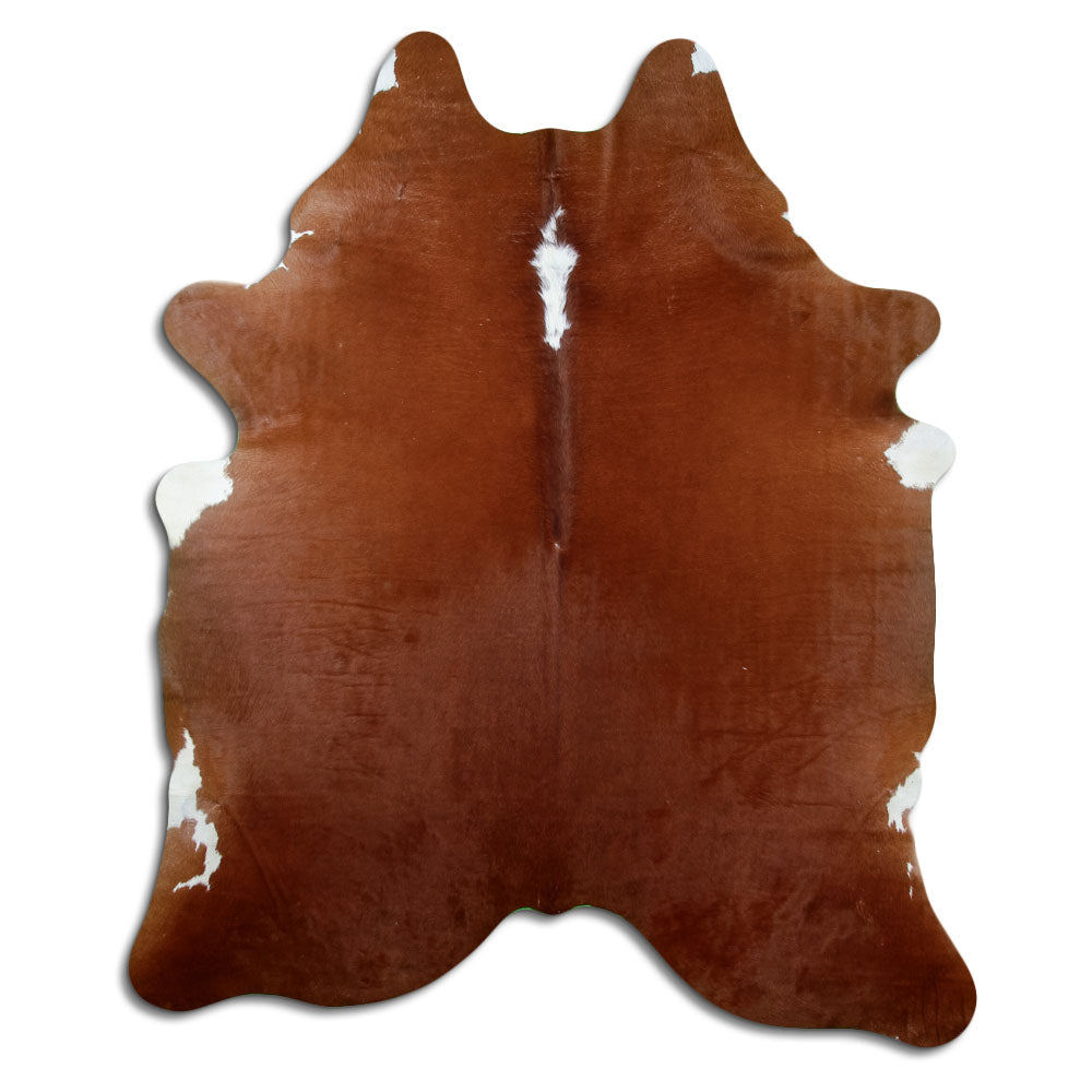 Peau de vache marron et blanc d’environ 210 × 180 cm, vue de dessus : exactement la peau que vous recevez