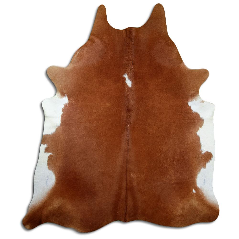 Peau de vache marron et blanc d’environ 230 × 190 cm, vue de dessus : exactement la peau que vous recevez