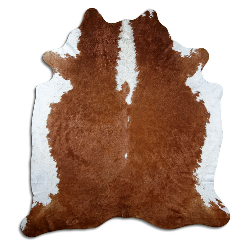 Peau de vache marron et blanc d’environ 220 × 200 cm, vue de dessus : exactement la peau que vous recevez