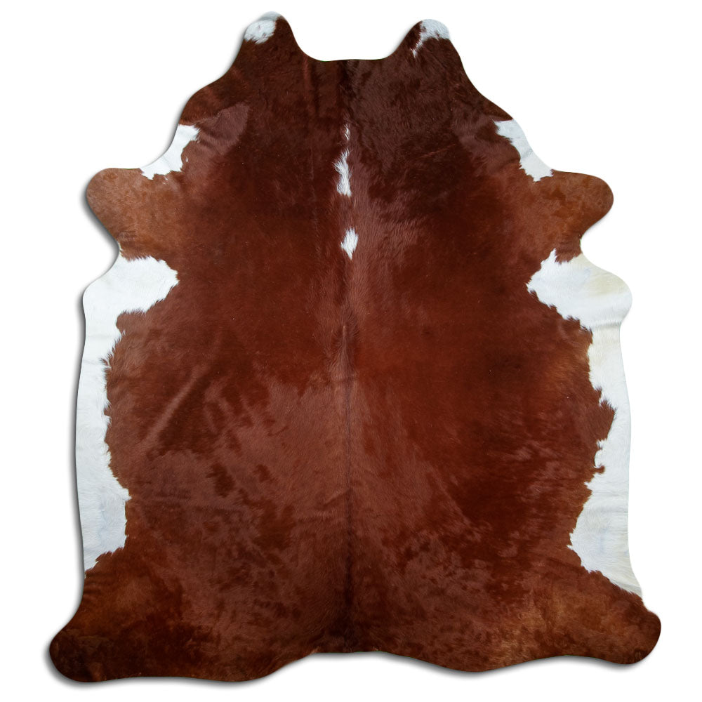 Peau de vache marron et blanc d’environ 240 × 210 cm, vue de dessus : exactement la peau que vous recevez