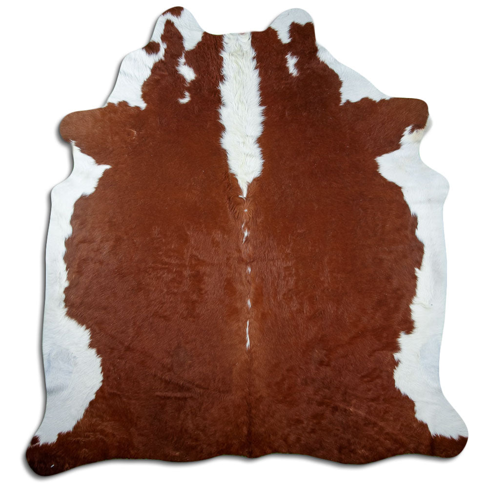 Peau de vache marron et blanc d’environ 240 × 220 cm, vue de dessus : exactement la peau que vous recevez