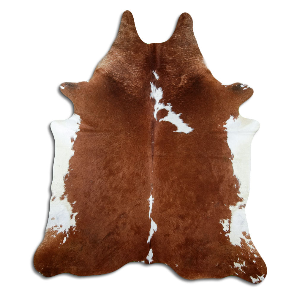 Peau de vache marron et blanc d’environ 220 × 200 cm, vue de dessus : exactement la peau que vous recevez