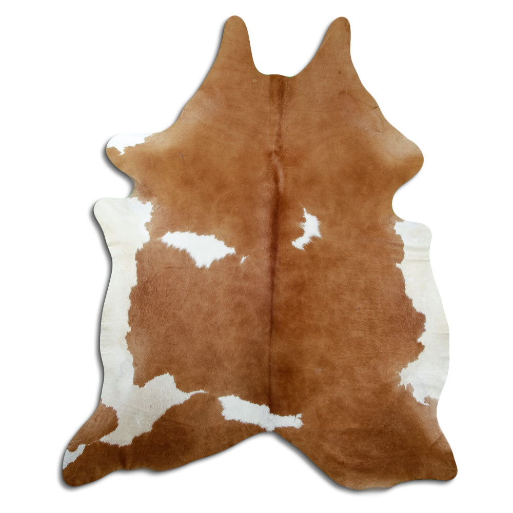 Peau de vache marron et blanc d’environ 220 × 190 cm, vue de dessus : exactement la peau que vous recevez