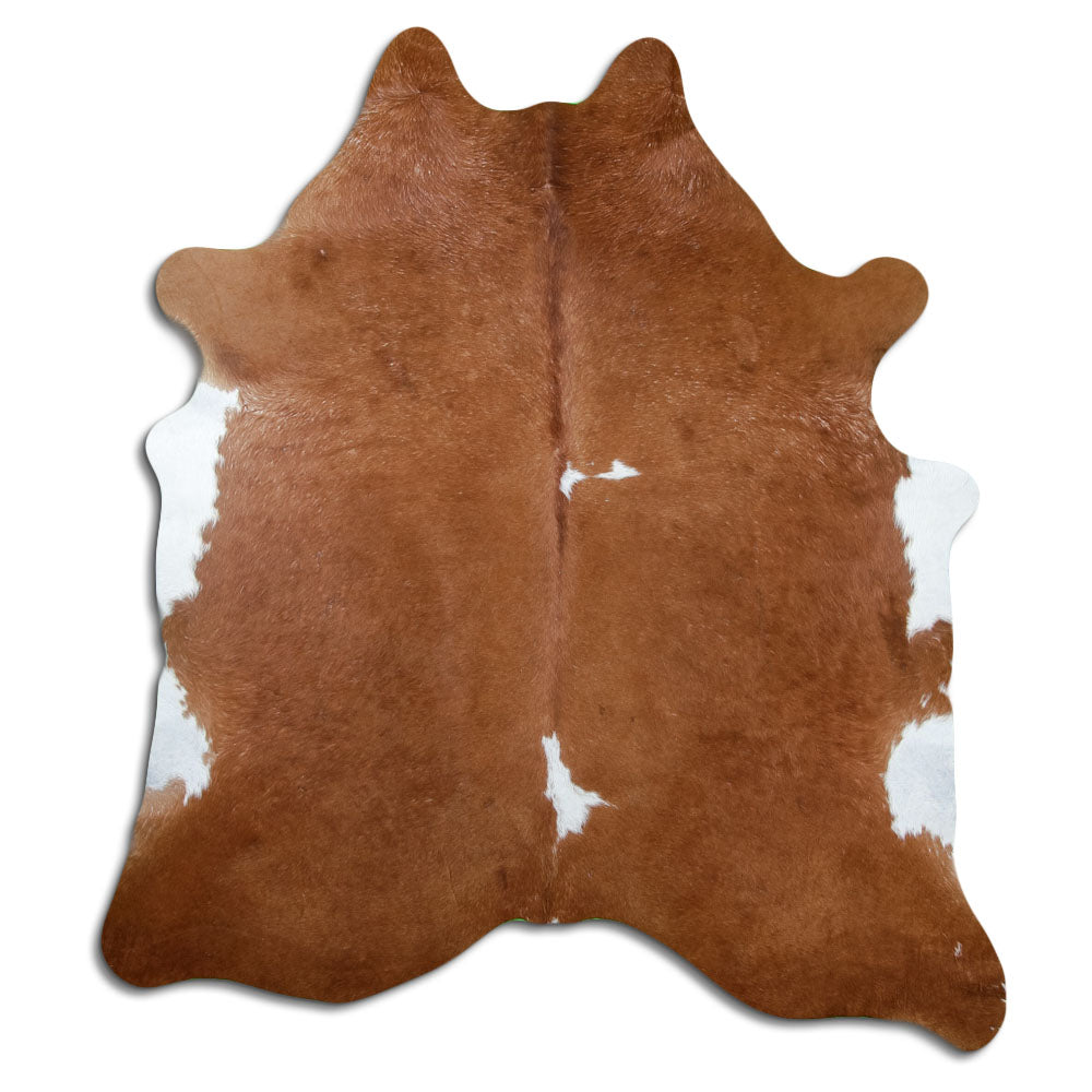 Peau de vache marron et blanc d’environ 210 × 190 cm, vue de dessus : exactement la peau que vous recevez