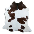 Peau de vache marron et blanc d’environ 200 × 180 cm, vue de dessus : exactement la peau que vous recevez