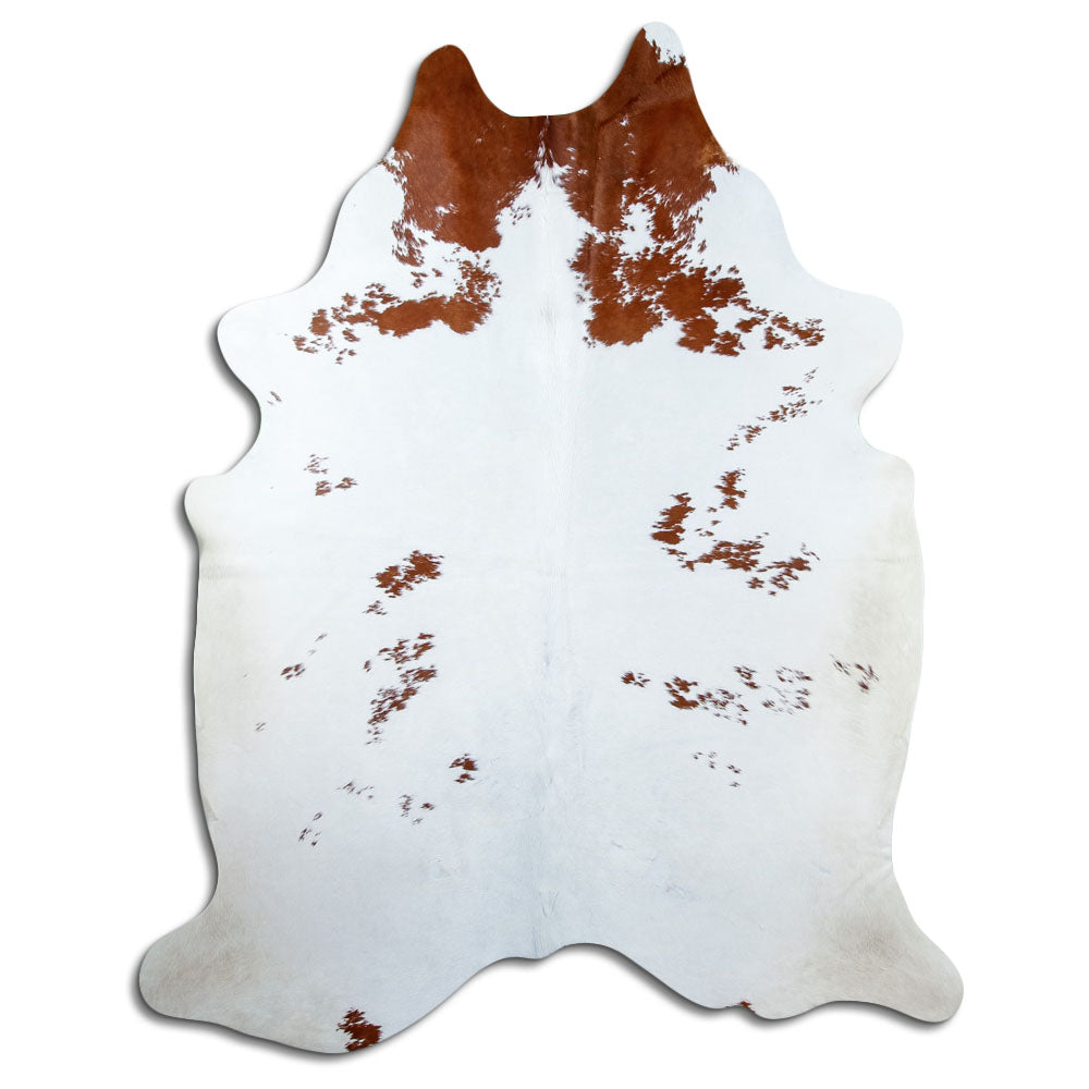 Peau de vache marron et blanc d’environ 220 × 180 cm, vue de dessus : exactement la peau que vous recevez