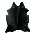 Peau de vache noire d’environ 200 × 160 cm, vue de dessus : exactement la peau que vous recevez