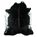 Peau de vache noire d’environ 210 × 180 cm, vue de dessus : exactement la peau que vous recevez