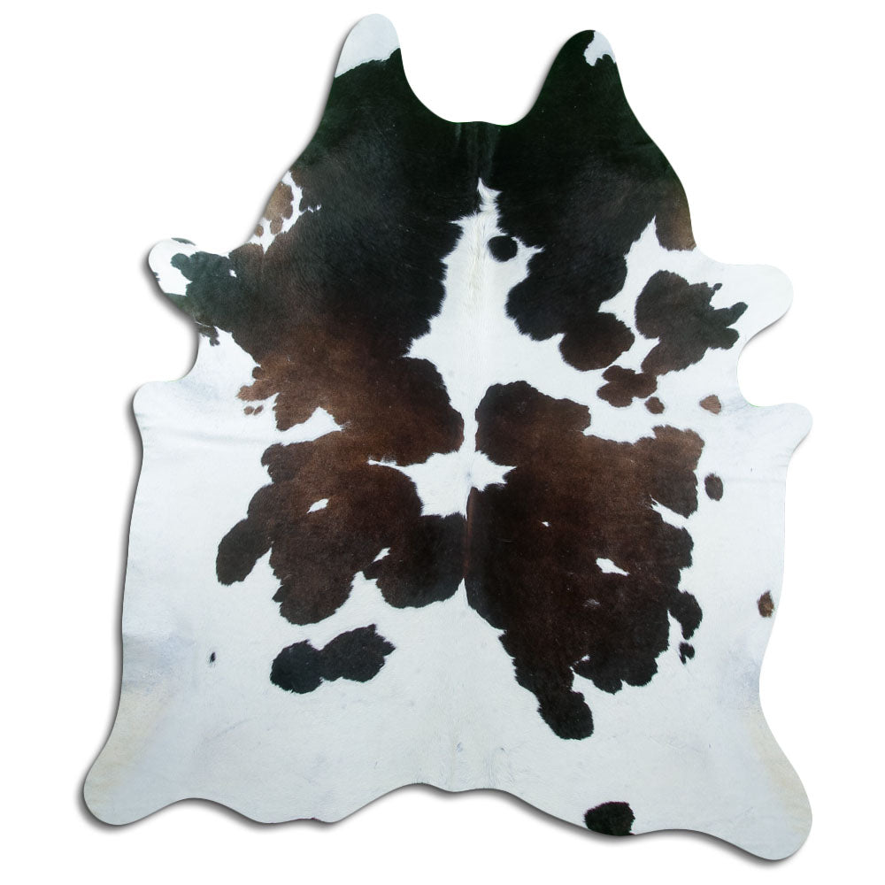 Peau de vache tricolore d’environ 220 × 190 cm, vue de dessus : exactement la peau que vous recevez