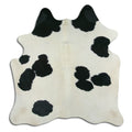 Peau de vache noire et blanche M