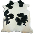Peau de vache noire et blanche XL