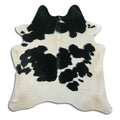 Peau de vache noire et blanche XL