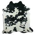 Peau de vache noire et blanche XL